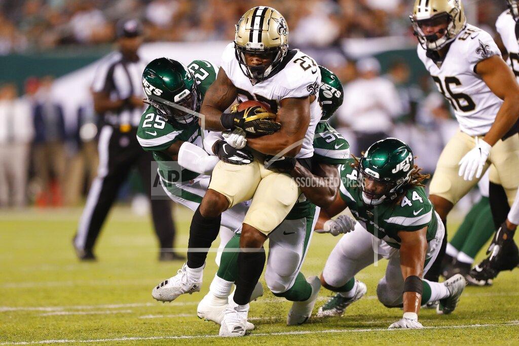 Noah K. Murray New Orleans Saints' Dwayne Washington (27) is tackled by New York Jets' Alex Brown (25) during the second half of a preseason NFL football game Saturday, Aug. 24, 2019, in East Rutherford, N.J. (AP Photo/Noah K. Murray)