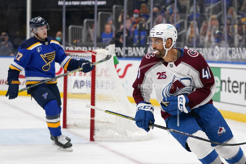 Jeff Roberson Colorado Avalanche's Pierre-Edouard Bellemare (41) looks back at he teammates after scoring an empty-net goal as St. Louis Blues' Torey Krug (47) skates in the background during the third period of an NHL hockey game Thursday, April 22, 2021, in St. Louis. (AP Photo/Jeff Roberson)