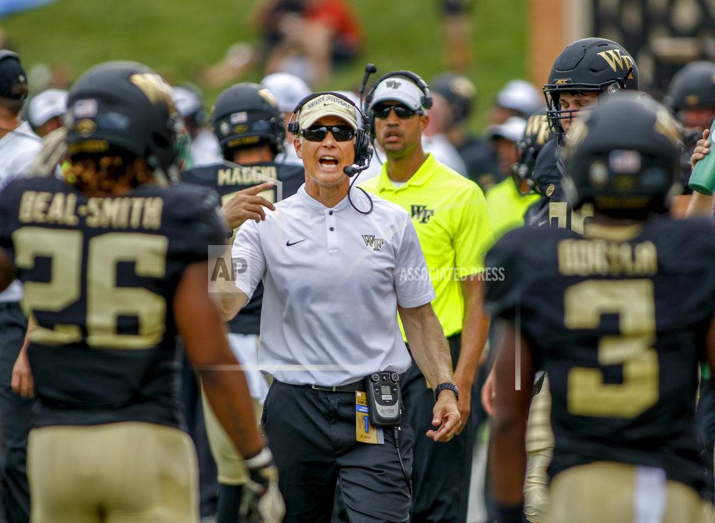 Nell Redmond Wake Forest coach Dave Clawson talks to his players in the first half of an NCAA college football game against Towson in Winston-Salem, N.C., Saturday, Sept. 8, 2018. (AP Photo/Nell Redmond)