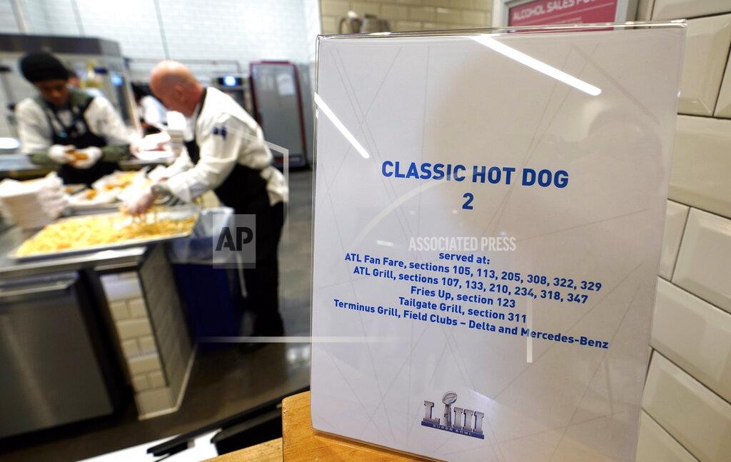 David J. Phillip FILE - In this Jan. 29, 2019, file photo, workers prepare food for a media tasting event during a tour of Mercedes-Benz Stadium for the NFL Super Bowl 53 football game in Atlanta. (AP Photo/David J. Phillip, File)