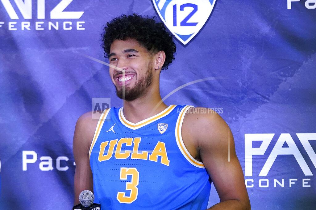 Jeff Chiu FILE - UCLA's Johnny Juzang smiles during Pac-12 Conference NCAA men's college basketball media day in San Francisco, in this Wednesday, Oct. 13, 2021, file photo. UCLA is No. 2 in The Associated Press Top 25 men's college basketball poll, released Monday, Oct. 18, 2021. Leading scorer Johnny Juzang (16.0 ppg) headlines a Bruins roster that returns nearly intact after last year’s run from the First Four to the Final Four, where they lost to Gonzaga on a halfcourt shot in an overtime classic. (AP Photo/Jeff Chiu, File)