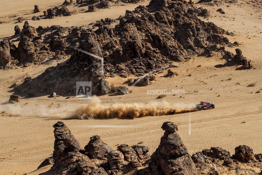 Bernat Armangue Driver Yazeed Al Qassimi, of Saudi Arabia, and co-driver Konstantin Zhiltsov, of Russia, race their Toyota during stage four of the Dakar Rally between Neom and Al Ula, in Saudi Arabia, Wednesday, Jan. 8, 2020. (AP Photo/Bernat Armangue)