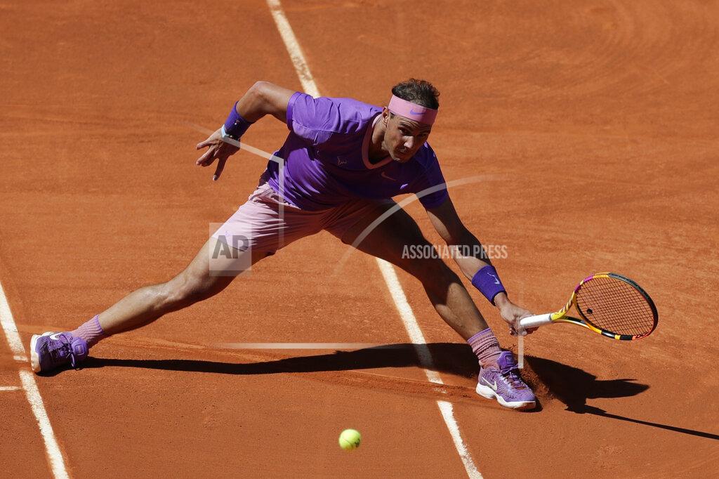 Paul White Rafael Nadal of Spain returns the ball to Alexei Popyrin of Australia during their match at the Madrid Open tennis tournament in Madrid, Spain, Thursday, May 6, 2021. (AP Photo/Paul White)