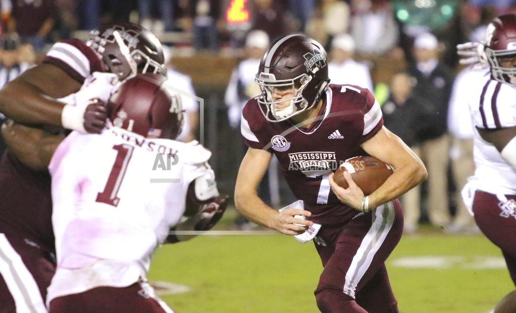 Jim Lytle Mississippi State quarterback Nick Fitzgerald (7) breaks through a hole in the line of scrimmage and runs for a 76-yard touchdown during the second half of an NCAA college football game against Texas A&M, Saturday, Oct. 27, 2018, in Starkville, Miss. (AP Photo/Jim Lytle)