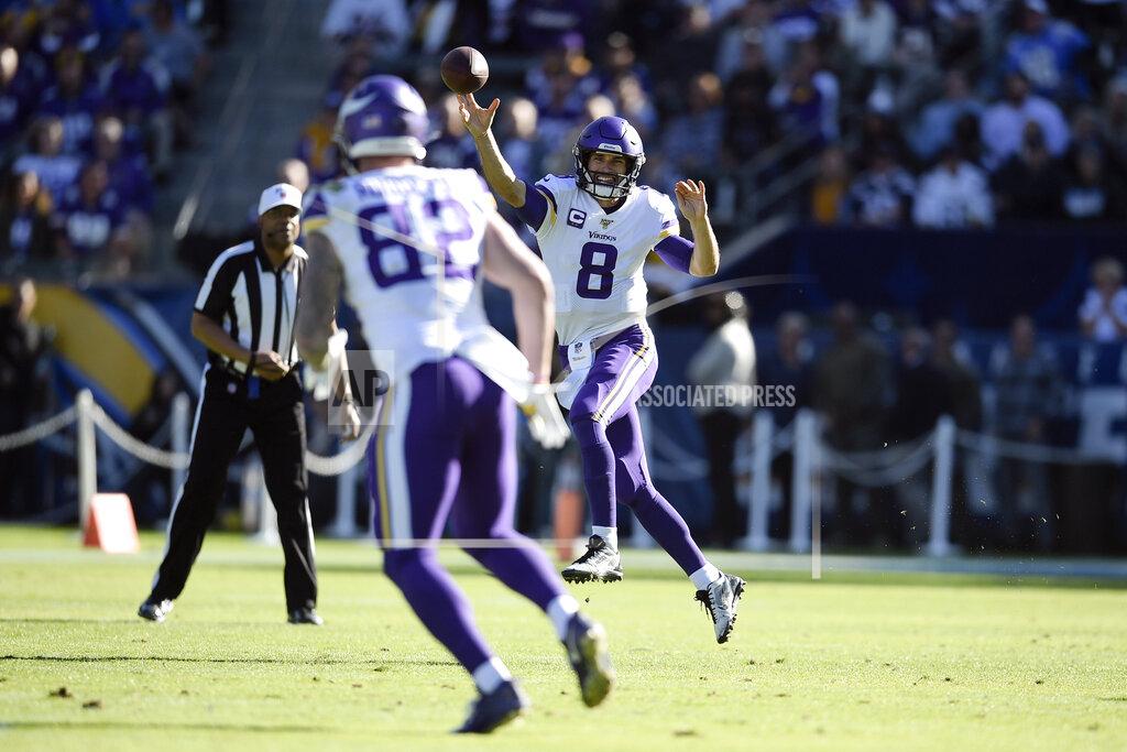 Minnesota Vikings quarterback Kirk Cousins throws a pass intended for tight end Kyle Rudolph (82) during the first half of an NFL football game against the Los Angeles Chargers Sunday, Dec. 15, 2019, in Carson, Calif. (AP Photo/Kelvin Kuo)