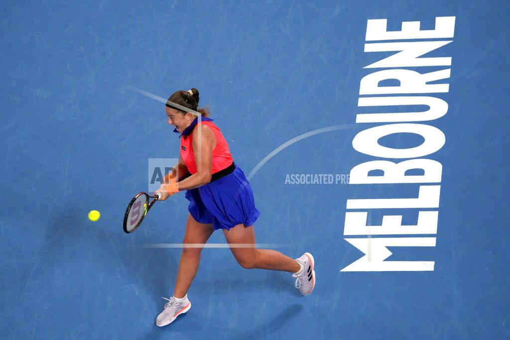 Ng Han Guan Jelena Ostapenko of Latvia plays a backhand return to Elena Rybakina of Kazakhstan during their quarterfinal match at the Australian Open tennis championship in Melbourne, Australia, Tuesday, Jan. 24, 2023. (AP Photo/Ng Han Guan)