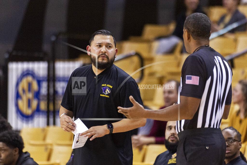 L.g. Patterson Paul Quinn head coach Brad Espinosa, left, talks to the referee during the first half of an NCAA college basketball game against Missouri Monday, Nov. 29, 2021, in Columbia, Mo. (AP Photo/L.G. Patterson)
