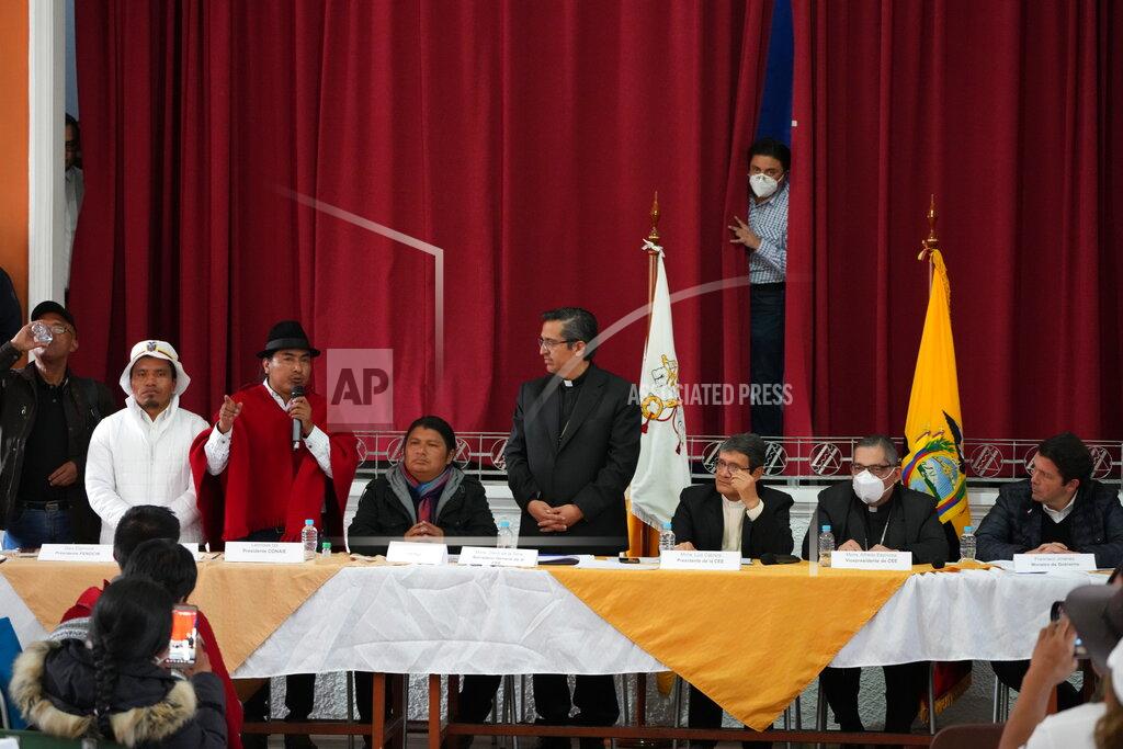 Dolores Ochoa Indigenous leader Leonidas Iza speaks after reaching an agreement with the government, as Catholic Church representatives serve as mediador, at the Episcopal Conference headquarters in Quito, Ecuador, Thursday, June 30, 2022. Ecuador's government and the country's main Indigenous group reached an agreement Thursday to end 18 days of often-violent strikes that had virtually paralyzed the country. (AP Photo/Dolores Ochoa)