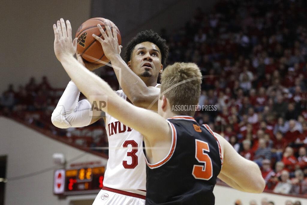Darron Cummings Indiana's Justin Smith (3) goes to the basket against Princeton's Drew Friberg (5) during the first half of an NCAA college basketball game Wednesday, Nov. 20, 2019, in Bloomington, Ind. (AP Photo/Darron Cummings)