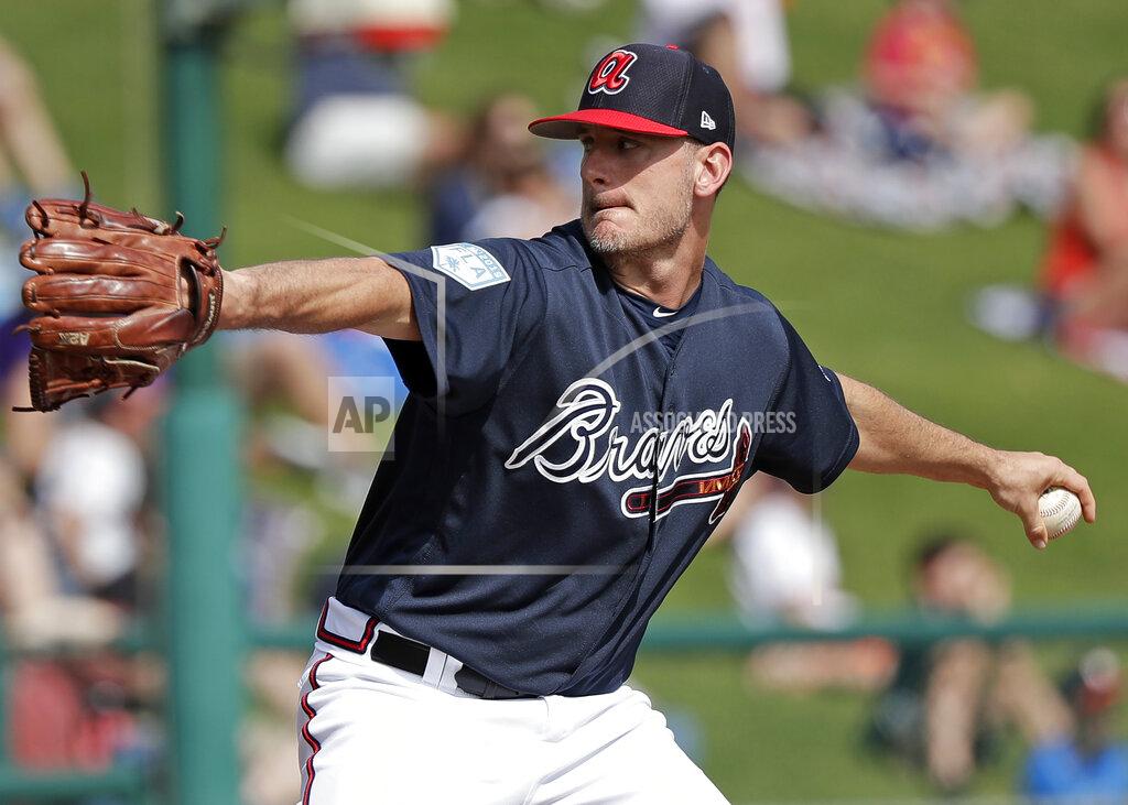 John Raoux FILE - In this March 4, 2019, file photo, Atlanta Braves' Grant Dayton pitches against the Houston Astros in the sixth inning of a spring baseball exhibition game in Kissimmee, Fla. Dayton is excited to driving north for the resumption of spring training with the Braves. He knows he will not be getting any more salary. "It's going to be weird not getting a paycheck," he said. Dayton is among 11 players who received $286,500 in advances that are higher than their prorated pay. (AP Photo/John Raoux, File)