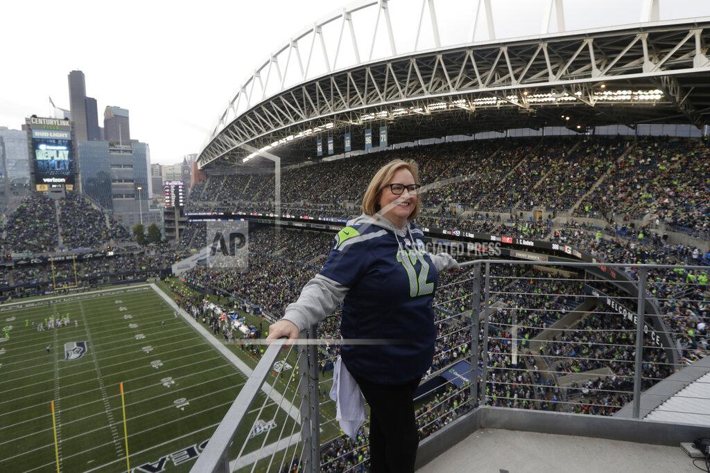 Stephen Brashear Seattle Seahawks owner Jody Allen stands on a balcony at CenturyLink Field after she raised the 12th man flag before the team's NFL football game against the Los Angeles Rams, Thursday, Oct. 3, 2019, in Seattle. (AP Photo/Stephen Brashear)