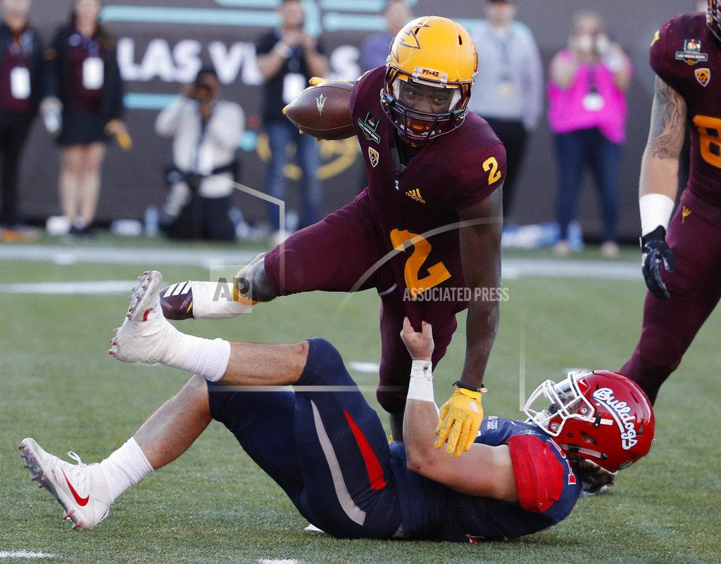 John Locher Fresno State linebacker George Helmuth (34) tackles Arizona State wide receiver Brandon Aiyuk (2) during the second half of the Las Vegas Bowl NCAA college football game, Saturday, Dec. 15, 2018, in Las Vegas. (AP Photo/John Locher)