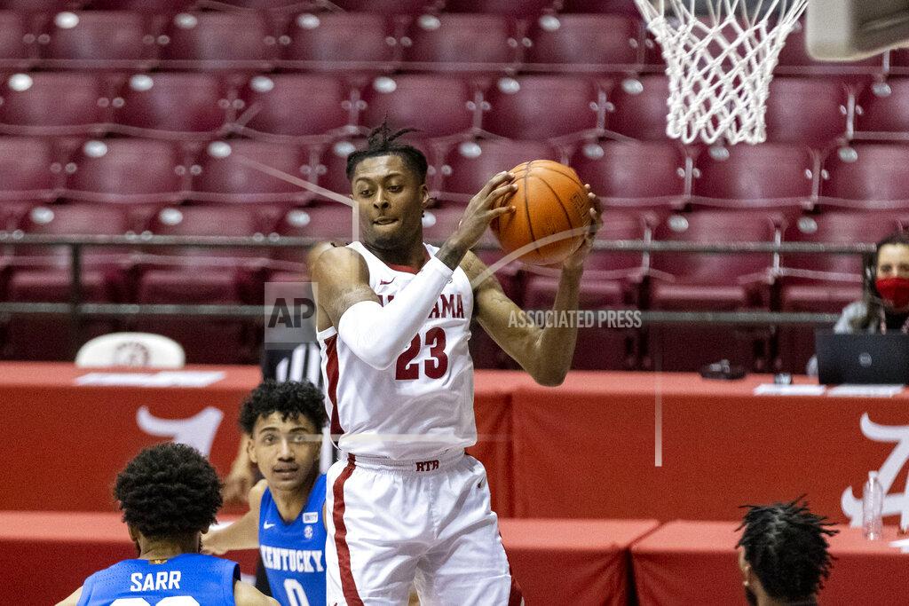 Vasha Hunt Alabama guard John Petty Jr. (23) grabs a rebound during the first half of the team's NCAA college basketball game against Kentucky, Tuesday, Jan. 26, 2021, in Tuscaloosa, Ala. (AP Photo/Vasha Hunt)