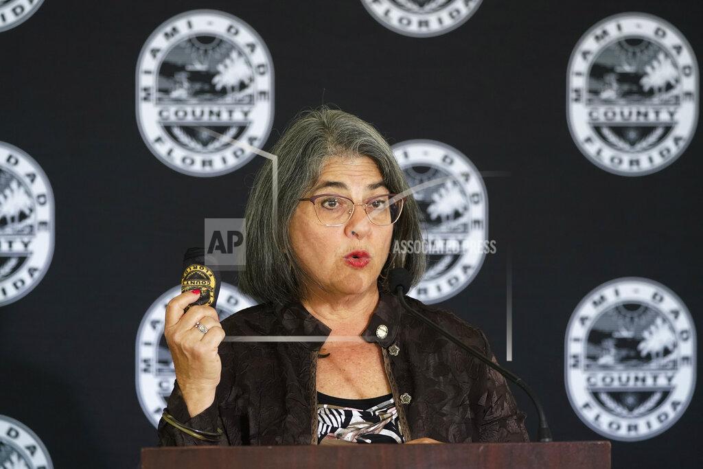 Wilfredo Lee FILE - In this Monday, April 5, 2021, file photo, Miami-Dade County Mayor Daniella Levine Cava holds up her mask as she speaks during a news conference, in Miami. As coronavirus cases continue to soar, two Florida mayors, including Levine Cava, are announcing mask and vaccine mandates and defying Gov. Ron DeSantis, who is firmly opposed to any pandemic restrictions. (AP Photo/Wilfredo Lee, File)