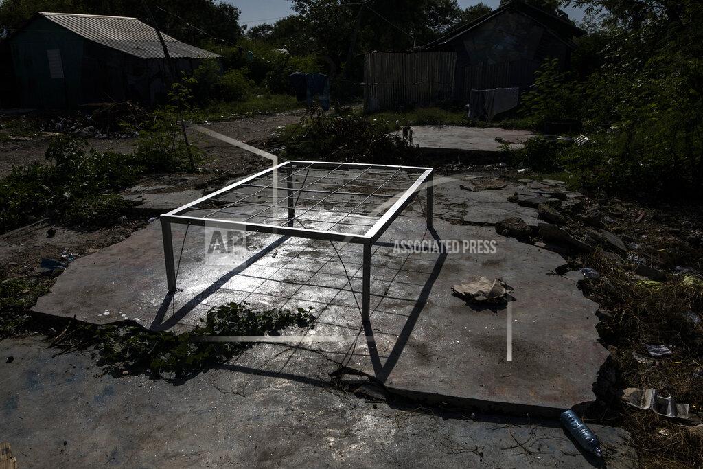 Rodrigo Abd An abandoned bed frame sits in the La Piste neighborhood, in Port-au-Prince, Haiti, Friday, Sept. 17, 2021. Gunmen laid siege to the encampment in June, a neighborhood of deaf and disabled Haitians relocated there by the International Red Cross after the 2010 earthquake leveled the capital. This time it was the police leading an assault at dusk. (AP Photo/Rodrigo Abd)