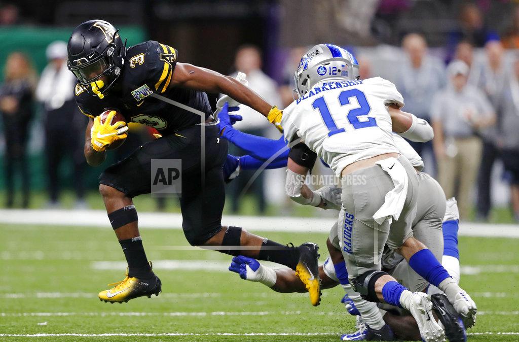 Gerald Herbert Appalachian State running back Darrynton Evans (3) carries against Middle Tennessee safety Reed Blankenship (12) in the first half of the New Orleans Bowl NCAA college football game in New Orleans, Saturday, Dec. 15, 2018. (AP Photo/Gerald Herbert)