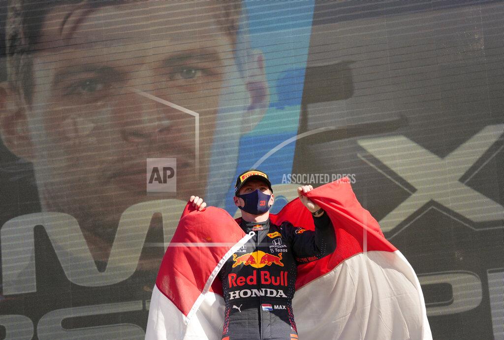 Francisco Seco Red Bull driver Max Verstappen of the Netherlands celebrates on the podium after winning the Formula One Dutch Grand Prix, at the Zandvoort racetrack, Netherlands, Sunday, Sept. 5, 2021. (AP Photo/Francisco Seco)