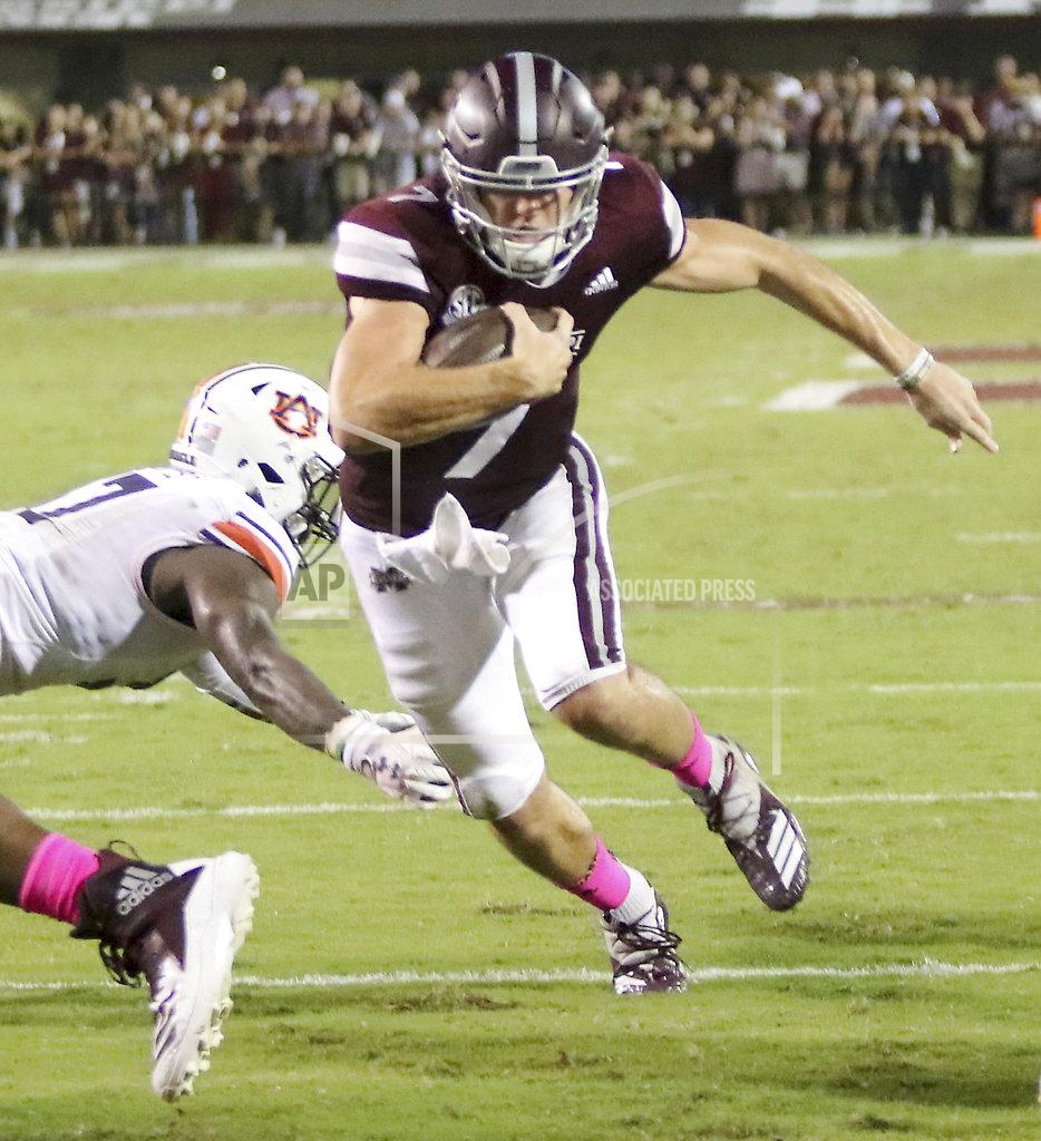 Jim Lytle Mississippi State quarterback Nick Fitzgerald (7) sprints past Auburn defender Deshaun Davis (57) and into the end zone for a touchdown during the first half of their NCAA college football game on Saturday, Oct. 6, 2018, in Starkville, Miss. (AP Photo/Jim Lyle)