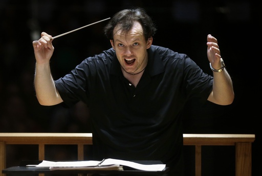 FILE - Boston Symphony Orchestra music director Andris Nelsons rehearses with the orchestra at Symphony Hall, Nov. 20, 2014, in Boston. Nelsons has agreed to a rolling contract as music director of the Boston Symphony Orchestra, the orchestra said Thursday, Jan. 25, 2024. (AP Photo/Steven Senne, File)
