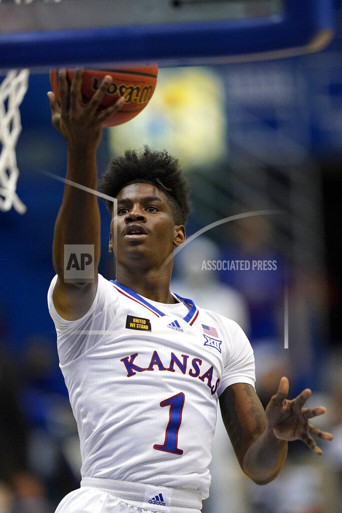 Orlin Wagner Kansas guard Tyon Grant-Foster drives for a basket during the first half of the team's NCAA college basketball game against Washburn in Lawrence, Kan., Thursday, Dec. 3, 2020. (AP Photo/Orlin Wagner)