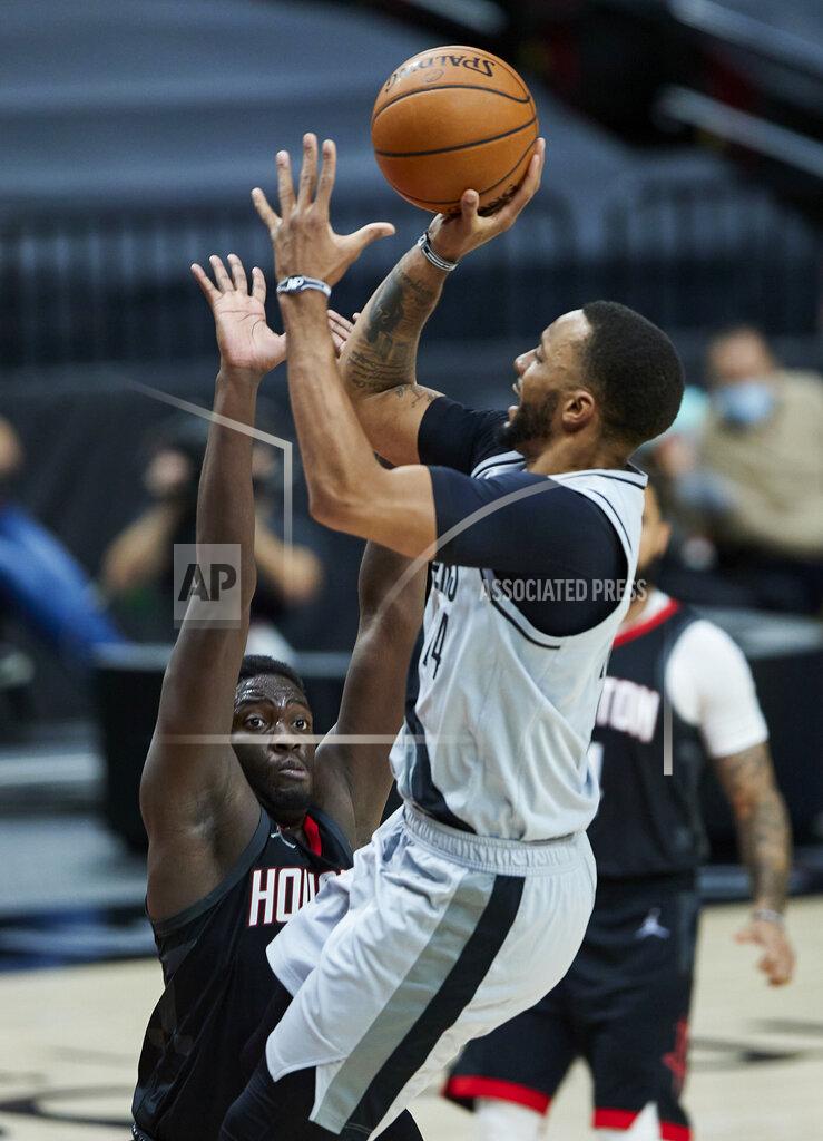 Craig Mitchelldyer Portland Trail Blazers forward Norman Powell, right, shoots over Houston Rockets forward Khyri Thomas during the second half of an NBA basketball game in Portland, Ore., Monday, May 10, 2021. (AP Photo/Craig Mitchelldyer)