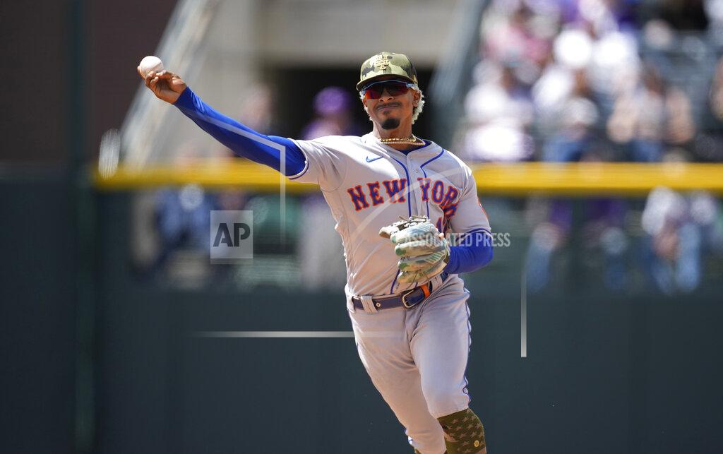 David Zalubowski New York Mets shortstop Francisco Lindor throws to first base to put out Colorado Rockies' Randal Grichuk in the fifth inning of a baseball game, Sunday, May 22 2022, in Denver. (AP Photo/David Zalubowski)