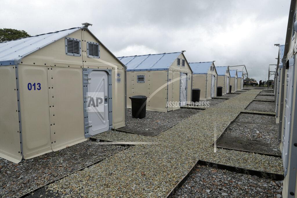 Arnulfo Franco Brand new shelters for migrants stand ready to be occupied amid the new coronavirus pandemic, in San Vicente, Darien province, Panama, Saturday, Aug. 29, 2020. The new shelters will house at least 400 migrants, most of them families with children. (AP Photo/Arnulfo Franco)