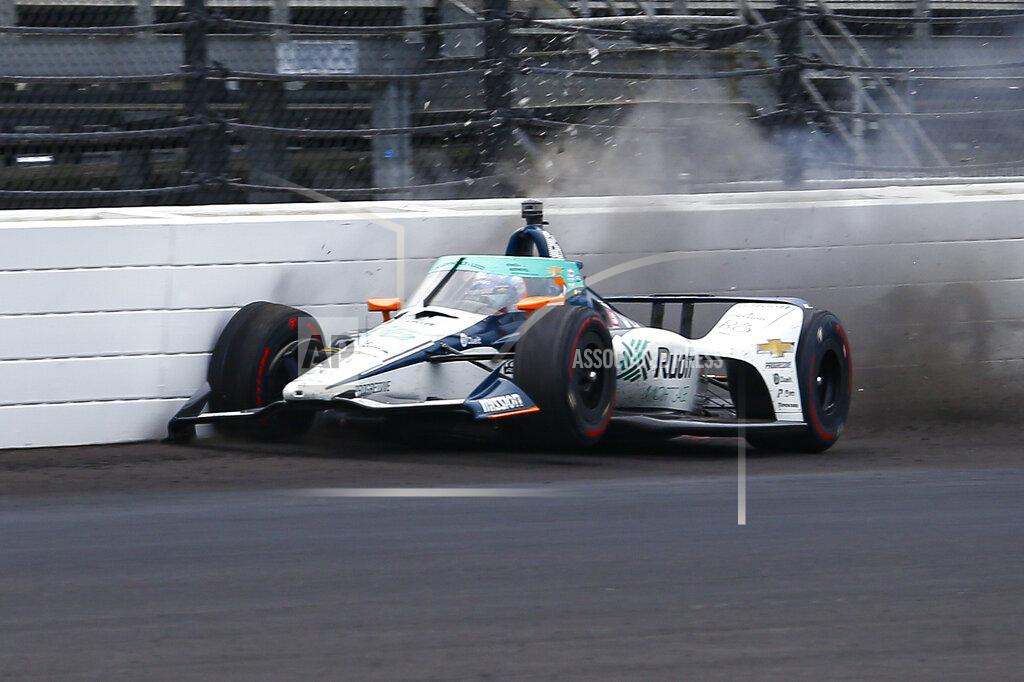 Kirk Stierwalt The car driven by Fernando Alonso, of Spain, hits the wall in the fourth turn during practice for the Indianapolis 500 auto race at Indianapolis Motor Speedway in Indianapolis, Thursday, Aug. 13, 2020. (AP Photo/Kirk Stierwalt)
