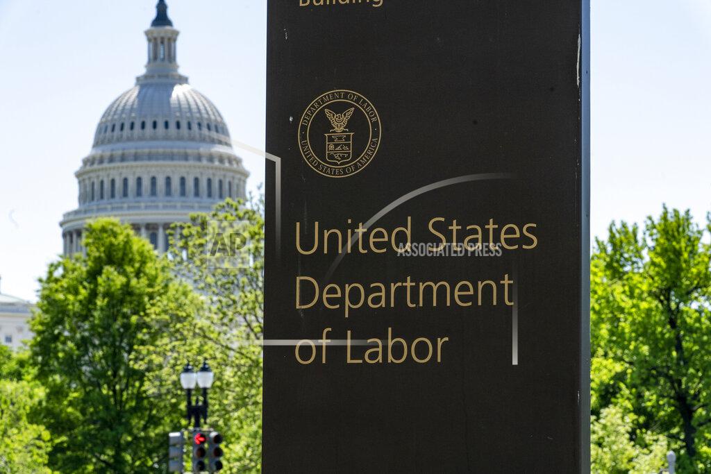 In this May 7, 2020, photo, the entrance to the Labor Department is seen near the Capitol in Washington. The record unemployment rate reflects a nation ravaged by the coronavirus pandemic, the economic devastation upending the presidential campaign and forcing President Donald Trump to overcome historic headwinds to win a second term. (AP Photo/J. Scott Applewhite)