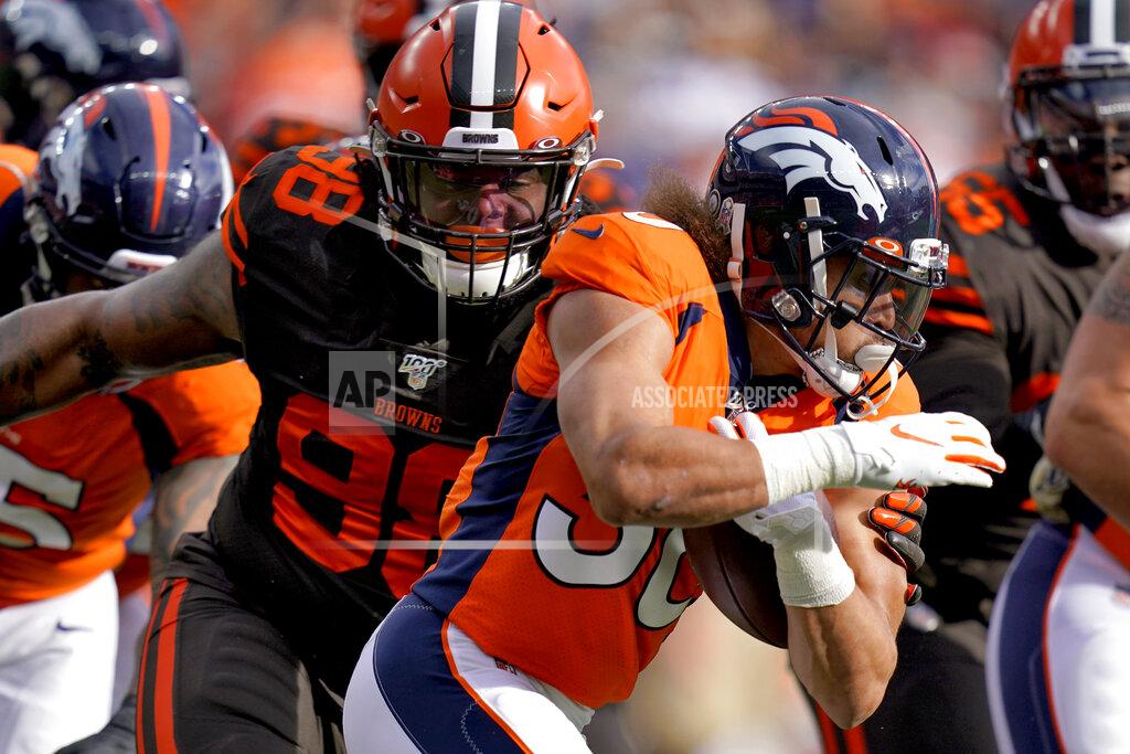 Jack Dempsey Denver Broncos running back Phillip Lindsay, right, tries to avoid Cleveland Browns defensive tackle Sheldon Richardson (98) during the first half of NFL football game, Sunday, Nov. 3, 2019, in Denver. (AP Photo/Jack Dempsey)