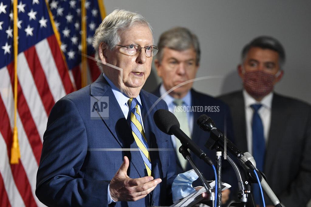 Susan Walsh Senate Majority Leader Mitch McConnell of Ky., left, speaks to reporters following the weekly Republican policy luncheon on Capitol Hill in Washington, Tuesday, June 9, 2020. Sen. Roy Blunt, R-Mo., center, and Sen. Cory Gardner, R-Colo., right, listen. (AP Photo/Susan Walsh)