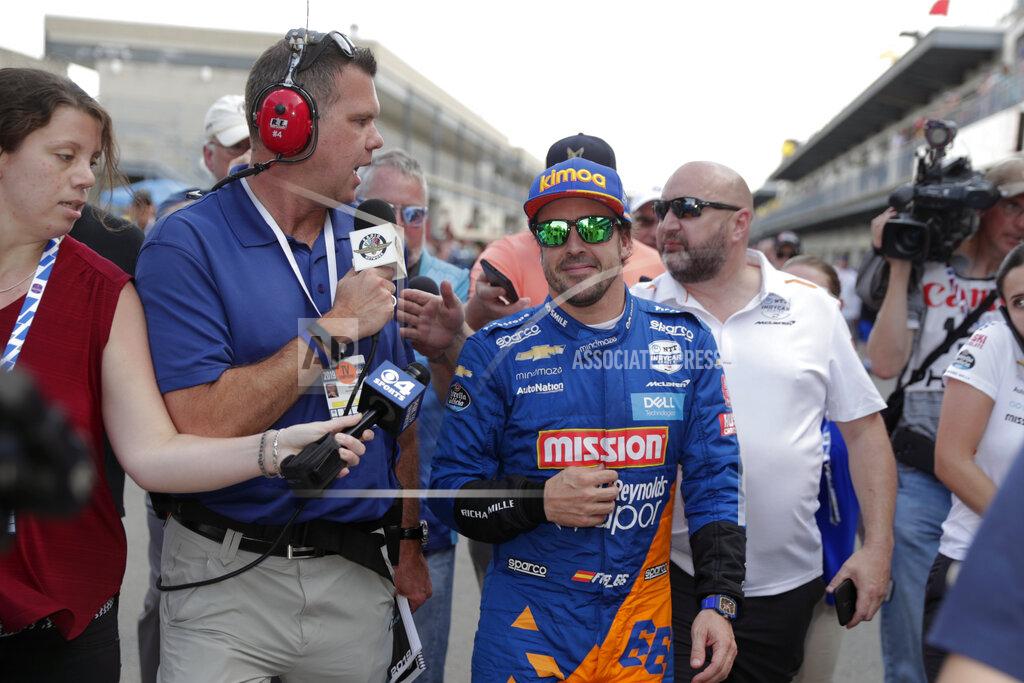Michael Conroy FILE - In this May 18, 2019, file photo, Fernando Alonso, of Spain, is interviewed as he walked from the pit area after qualifications ended for the Indianapolis 500 IndyCar auto race at Indianapolis Motor Speedway in Indianapolis. Alonso feels far better about his chances to close out motorsports' version of the Triple Crown this year. The Spaniard will race for Arrow McLaren SP in the Indianapolis 500 and believes the organization is prepared. (AP Photo/Michael Conroy, File)