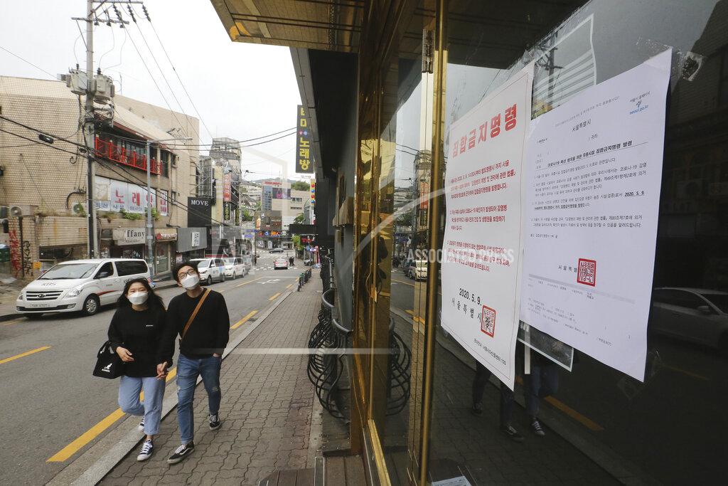 Ahn Young-Joon FILE - In this May 10, 2020, file photo, notices of the Seoul city emergency administrative order to prohibit gathering are posted at the entrance of a temporary closed dance club in Seoul, South Korea. The sign reads: "The Seoul city emergency administrative order to prohibit gathering." As South Korea grapples with a new spike in coronavirus infections thought to be linked to nightspots in Seoul, including several popular with gay men, it's also seeing rising homophobia that's making it difficult for sexual minorities to come forward for diagnostic tests. (AP Photo/Ahn Young-joon, File)