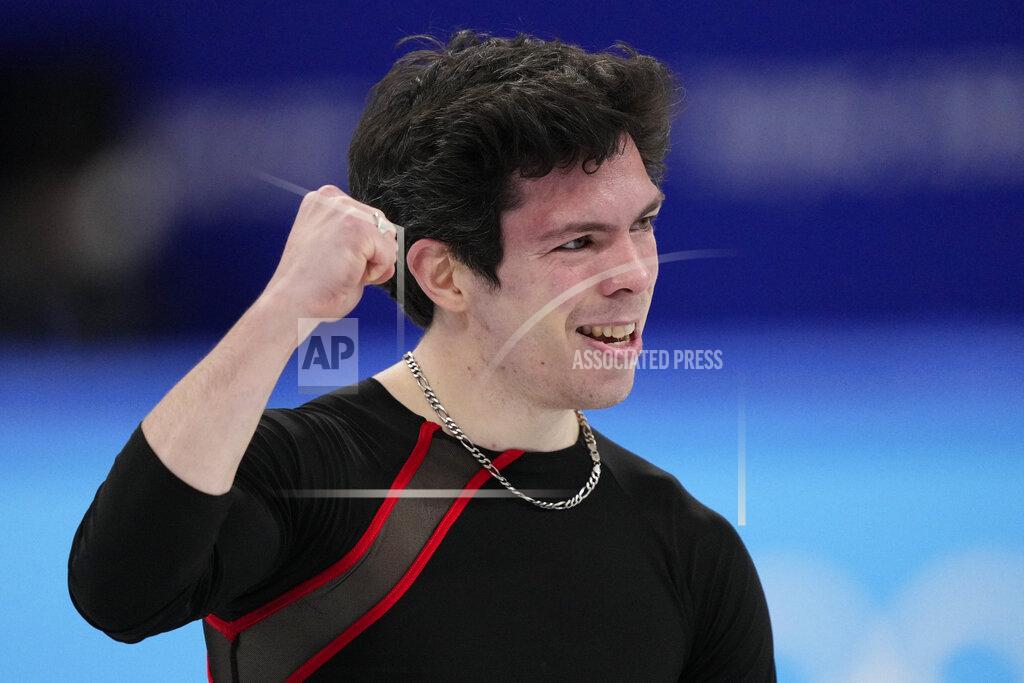 Keegan Messing, of Canada, competes during the men's short program figure skating competition at the 2022 Winter Olympics, Tuesday, Feb. 8, 2022, in Beijing. (AP Photo/Bernat Armangue)