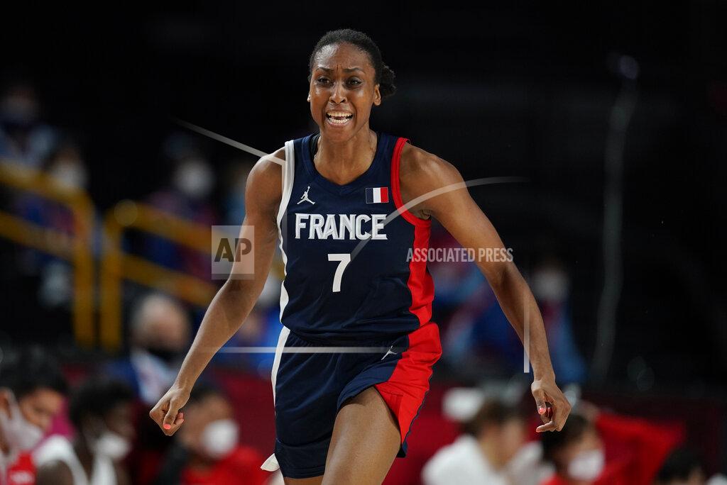 Charlie Neibergall France's Sandrine Gruda (7) celebrates after making a basket during women's basketball preliminary round game against Japan at the 2020 Summer Olympics, Tuesday, July 27, 2021, in Saitama, Japan. (AP Photo/Charlie Neibergall)