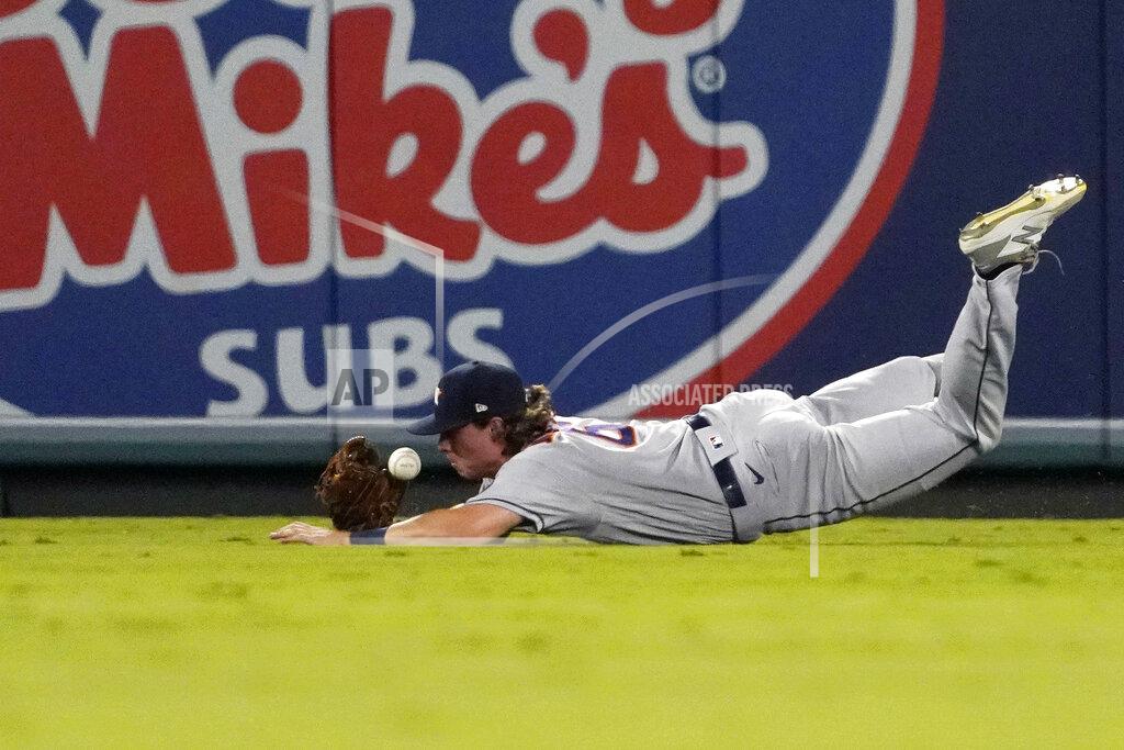 Mark J. Terrill Houston Astros center fielder Jake Meyers attempts to make a catch on a ball hit by Los Angeles Angels' Brandon Marsh during the third inning of a baseball game Wednesday, Sept. 22, 2021, in Anaheim, Calif. Marsh was safe at first on the play. (AP Photo/Mark J. Terrill)