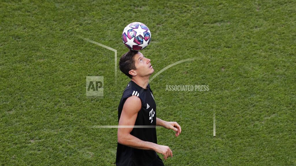Manu Fernandez Bayern's Robert Lewandowski plays with a ball during a training session at the Luz stadium in Lisbon, Saturday Aug. 22, 2020. Bayern Munich will play PSG in the Champions League final soccer match on Sunday. AP Photo/Manu Fernandez, Pool)