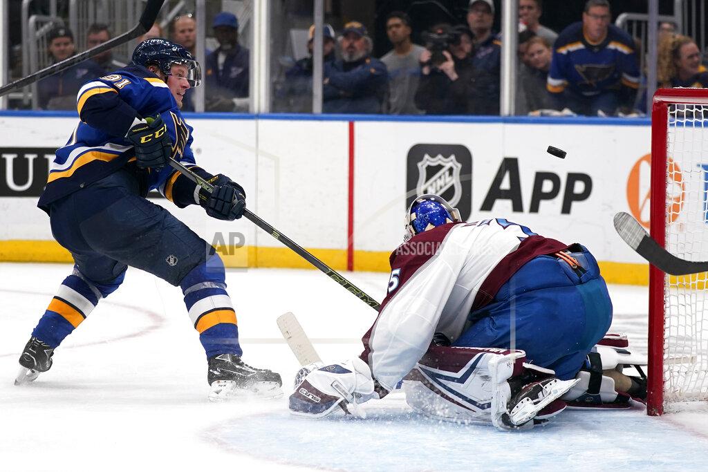 Jeff Roberson St. Louis Blues' Vladimir Tarasenko, left, shoot wide of Colorado Avalanche goaltender Darcy Kuemper during the second period in Game 4 of an NHL hockey Stanley Cup second-round playoff series Monday, May 23, 2022, in St. Louis. (AP Photo/Jeff Roberson)
