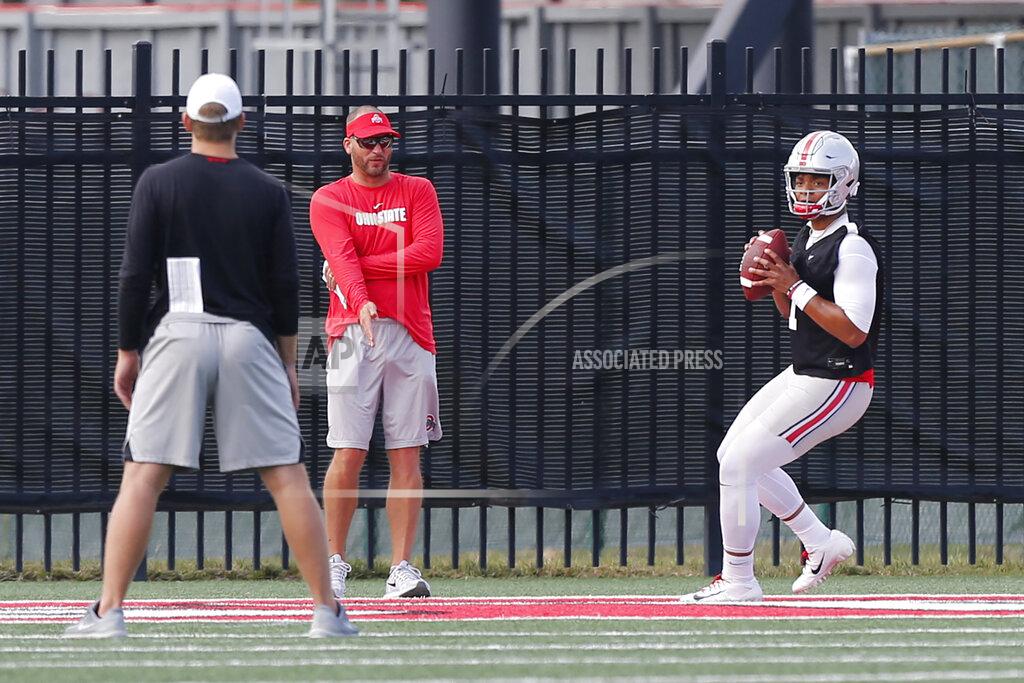 Jay Laprete Ohio State quarterback Justin Fields drops back to pass during NCAA college football practice, Friday, Aug. 2, 2019, in Columbus, Ohio. (AP Photo/Jay LaPrete)