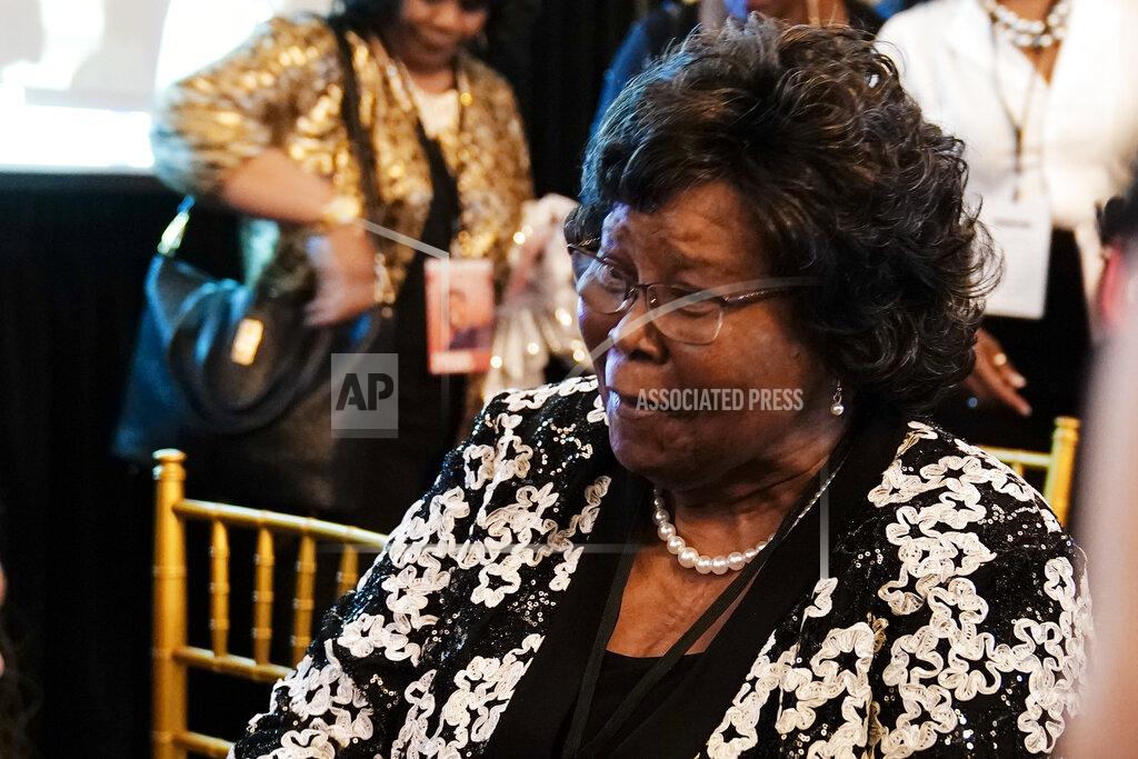 Brynn Anderson Christine Walker, the mother of U.S. Senate candidate Herschel Walker, speaks to friends during an election night watch party, Tuesday, May 24, 2022, in Atlanta. (AP Photo/Brynn Anderson)