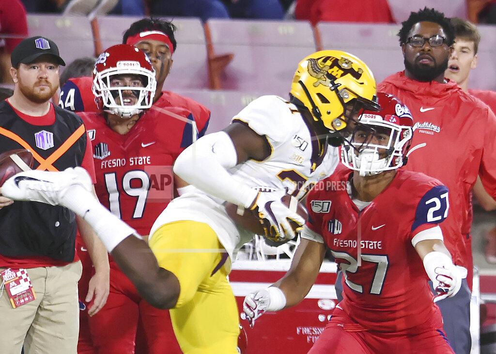 Eric Paul Zamora Minnesota's Kiondre Thomas, left, intercepts a pass intended for Fresno State's Zane Pope, right, during an NCAA college football game Saturday, Sept. 7, 2019, in Fresno, Calif. (Eric Paul Zamora/The Bee via AP)