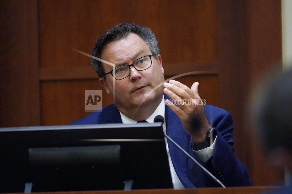 Steve Helber Dr. Richard Moore, Jr., testifies in the courtroom at the Fairfax County Circuit Courthouse in Fairfax, Va., Monday, May 23, 2022. Actor Johnny Depp sued his ex-wife Amber Heard for libel in Fairfax County Circuit Court after she wrote an op-ed piece in The Washington Post in 2018 referring to herself as a "public figure representing domestic abuse." (AP Photo/Steve Helber, Pool)