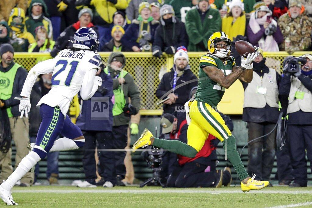 Darron Cummings Green Bay Packers' Davante Adams catches a touchdown pass during the first half of an NFL divisional playoff football game against the Seattle Seahawks Sunday, Jan. 12, 2020, in Green Bay, Wis. (AP Photo/Darron Cummings)