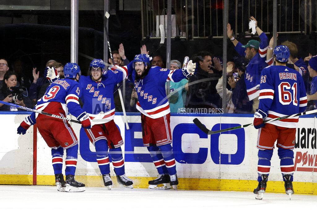 Adam Hunger New York Rangers center Mika Zibanejad (93) celebrates with teammates after scoring a goal against the Pittsburgh Penguins during the third period in Game 7 of an NHL hockey Stanley Cup first-round playoff series Sunday, May 15, 2022, in New York. (AP Photo/Adam Hunger)