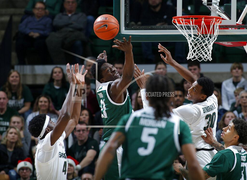 Al Goldis Eastern Michigan's Boubacar Toure, center, and Michigan State's Gabe Brown, left, and Marcus Bingham Jr. (30) vie for a rebound during the first half of an NCAA college basketball game, Saturday, Dec. 21, 2019, in East Lansing, Mich. (AP Photo/Al Goldis)
