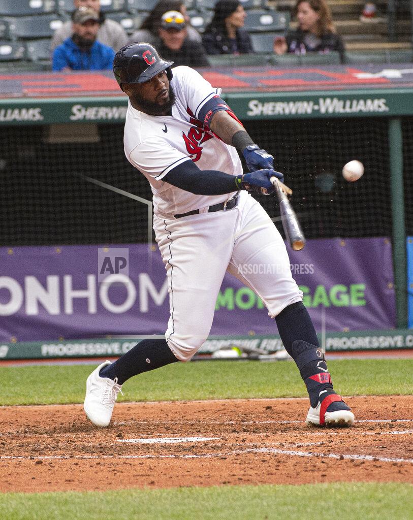 Phil Long Cleveland Indians' Franmil Reyes hits an RBI single during the sixth inning of a baseball game in Cleveland, Monday, April 26, 2021. (AP Photo/Phil Long)