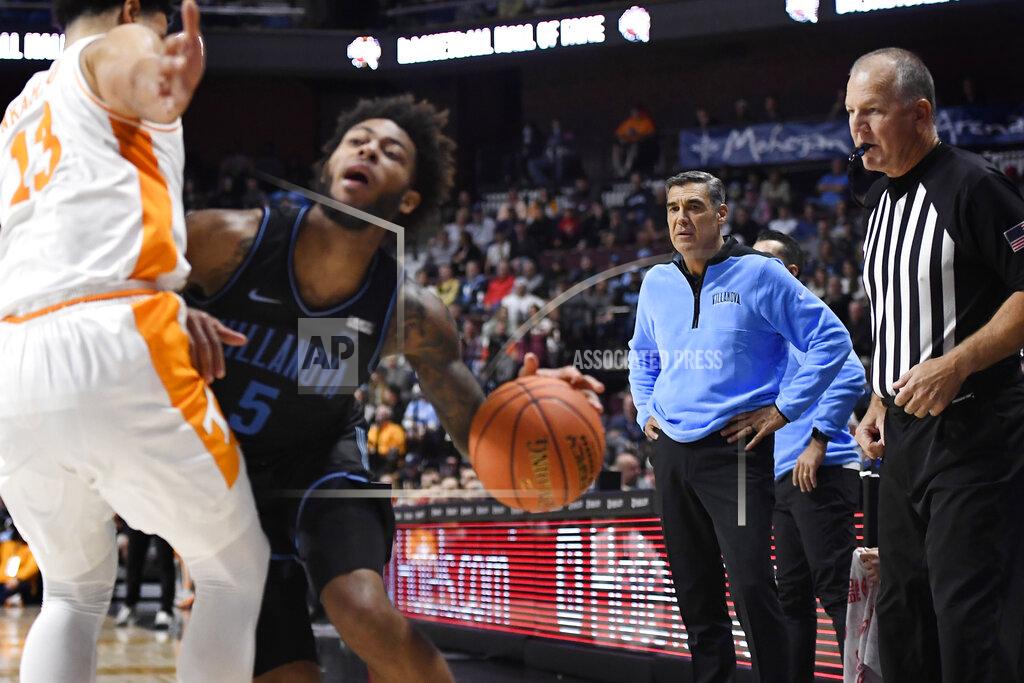 Jessica Hill Villanova head coach Jay Wright, second from right, watches a play in the second half of an NCAA college basketball game against Tennessee, Saturday, Nov. 20, 2021, in Uncasville, Conn. (AP Photo/Jessica Hill)