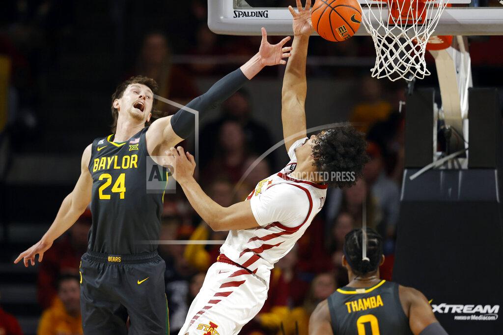 Matthew Putney Baylor guard Matthew Mayer (24) pokes the ball away from Iowa State forward Robert Jones (12) during the second half of an NCAA college basketball game, Saturday, Jan. 1, 2022, in Ames. Baylor won 77-72. (AP Photo/Matthew Putney)