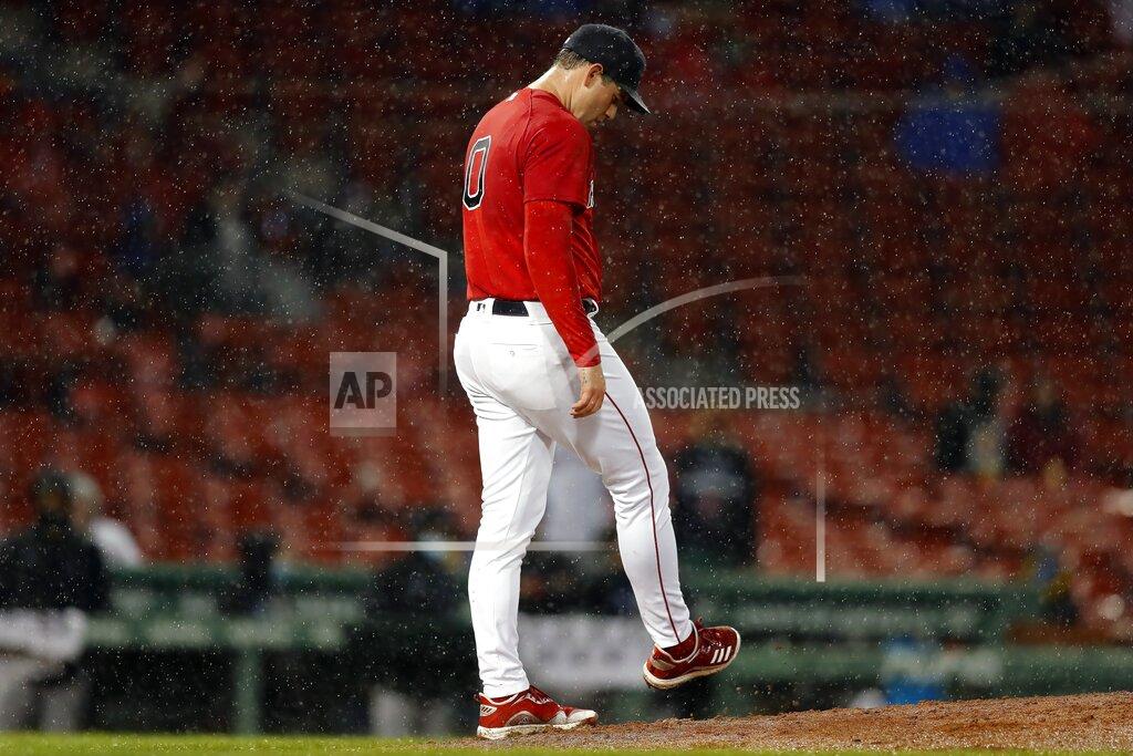 Michael Dwyer Boston Red Sox's Adam Ottavino reacts after giving up his third walk of the sixth inning to Miami Marlins' Jorge Alfaro to load the bases during a baseball game, Friday, May 28, 2021, in Boston. (AP Photo/Michael Dwyer)