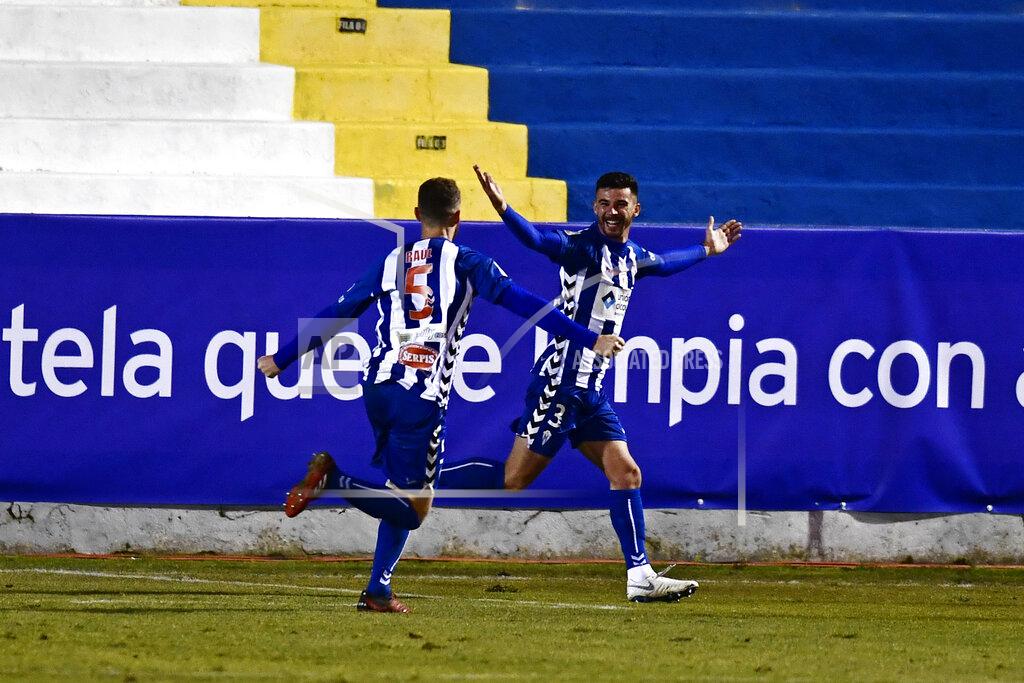 Jose Breton Alcoyano's Jose Solbes, right celebrates with Raul after scoring the equaliser, his side's first goal during a Spanish Copa del Rey round of 32 soccer match between Alcoyano and Real Madrid at the El Collao stadium in Alcoy, Spain, Wednesday Jan. 20, 2021. (AP Photo/Jose Breton)